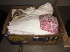 A box of linen including gown & table cloths etc.