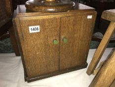 An oak smoker's cabinet.