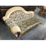 A decorative gilded chaise longue
