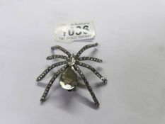 A large vintage spider brooch.