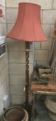 A carved wood lampstand