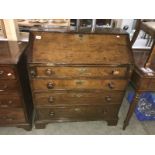 A 4 drawer oak bureau.