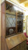 A mahogany astragal glazed bureau book case.