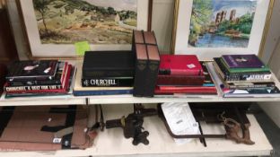 A large box of books & ephemera written by & about Winston Spencer Churchill includes 4 volumes of