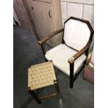 A 1930's oak arm chair and stool