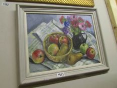 An oil on panel painting of still life with fruit and jug by Leslie Iwar Burton (1927 -2014) signed