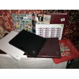 A collection of stamps including 14 generic sheets, albums of mint stamps, sheets,