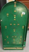 A green painted bagatelle