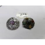 A Scottish silver brooch set amethyst and a Scottish silver brooch set coloured 'pebbles'.