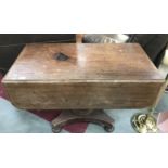 A Victorian mahogany centre pedestal drop leaf table