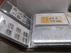 2 large albums of Royal Mail presentation packs (with high face value) and 2 other books of stamps.