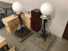 A pair of outdoor globe drive lights.