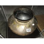 An Asian metal cooking pot.