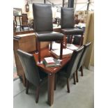 An extendable dining table & 6 chairs