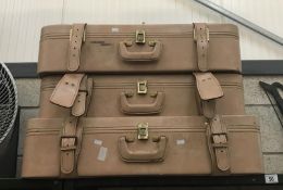 3 faux leather suit cases