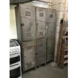 An old metal 6 cupboard locker unit