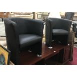 2 leather tub chairs