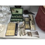 A quantity of cutlery including cased