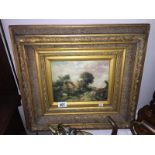 A framed & glazed overpainted print of sheep & cattle in gilt frame