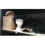 A quantity of hats and an old hat box