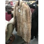 2 fur coats (1 faux) size S,