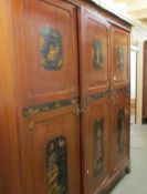 A Chinoiserie triple wardrobe with matching bedstead by S.