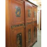 A Chinoiserie triple wardrobe with matching bedstead by S.