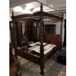 A 5ft mahogany four poster bed.