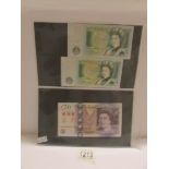 An unused £20 note (Chinese over stamp?), 2 green UK £1 notes, unused,