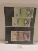 An unused £20 note (Chinese over stamp?), 2 green UK £1 notes, unused,
