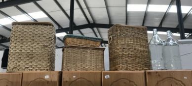 4 items of wicker ware including linen bins & 2 glass bottles