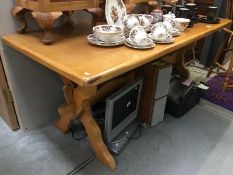 A pine wedge and stretcher kitchen table