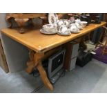 A pine wedge and stretcher kitchen table