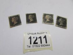 4 Penny Black British stamps.