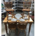 A solid pine kitchen table & 6 chairs