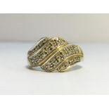 A 9ct gold & pave diamonds twist ring