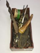 A small box of miscellaneous metal household items including corkscrews,