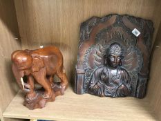 An oriental resin wall plaque with bronzed finish and wooden elephant (1 tusk missing A/F)