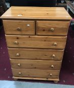 A 6 drawer pine chest of drawers