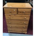 A 6 drawer pine chest of drawers