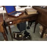 A mahogany fold over table.