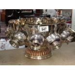 A silver plated lion head handle punch bowl with 8 cups