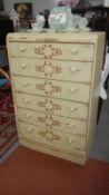 A shabby chic cream coloured 6 drawer chest with brown vine stencilling