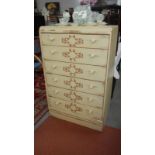 A shabby chic cream coloured 6 drawer chest with brown vine stencilling