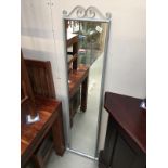 A long metal framed modern mirror