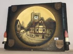 A large illuminated chalkware plaque with integral clock & wall lights