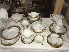 A gold decorated dinner service.