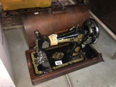 A cased Singer sewing machine