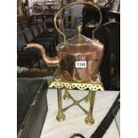 A Victorian copper kettle and a Victorian brass trivet.