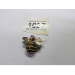 A silver tigers eye pendant fashioned as a bee. Total weight 5.46 grams.